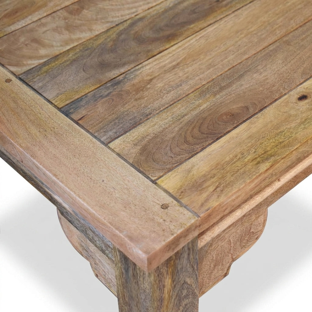 Close-up of a wooden table with a natural finish on a white background